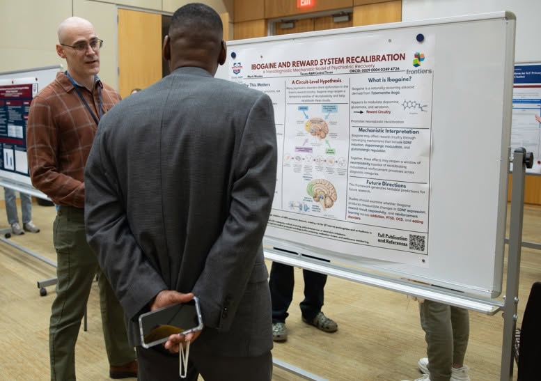 Mark Nicolas discussing his ibogaine research poster at Texas A&M University Central Texas